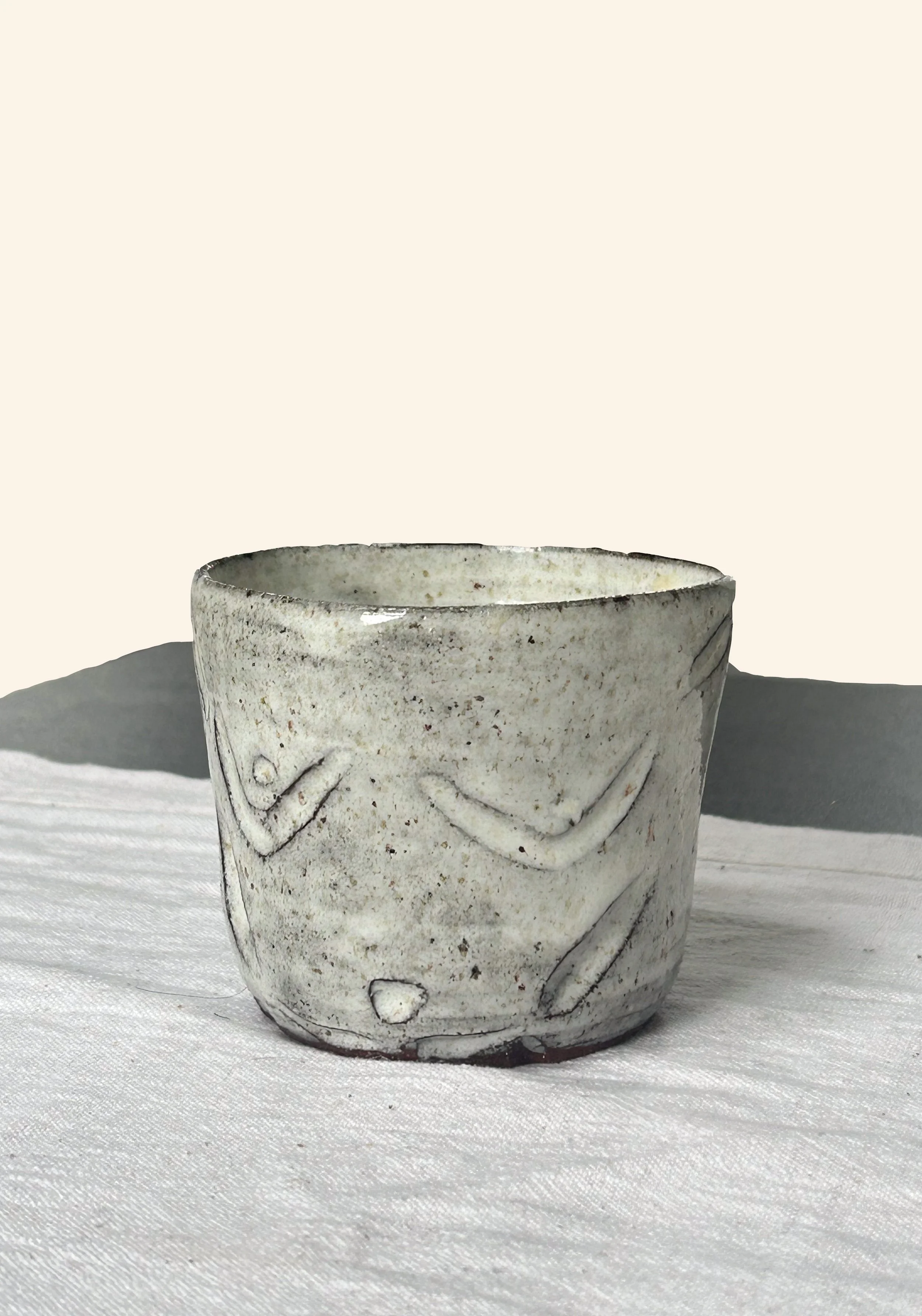 Ceramic body with carvings.