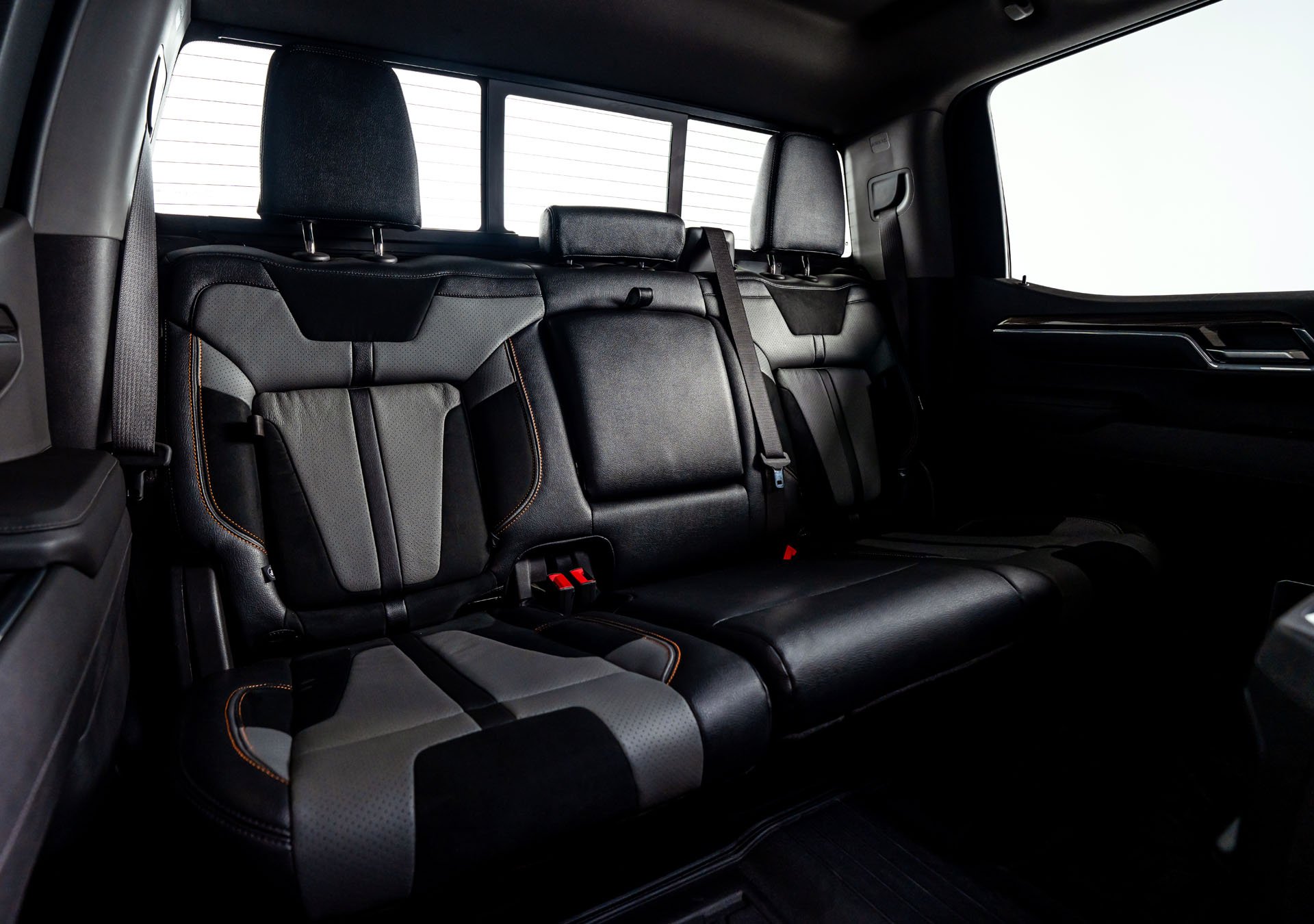 Custom Orange Stitched Two-Tone Leather Seats with Alcantara Suede Inserts and FOX Factory Embroidery
