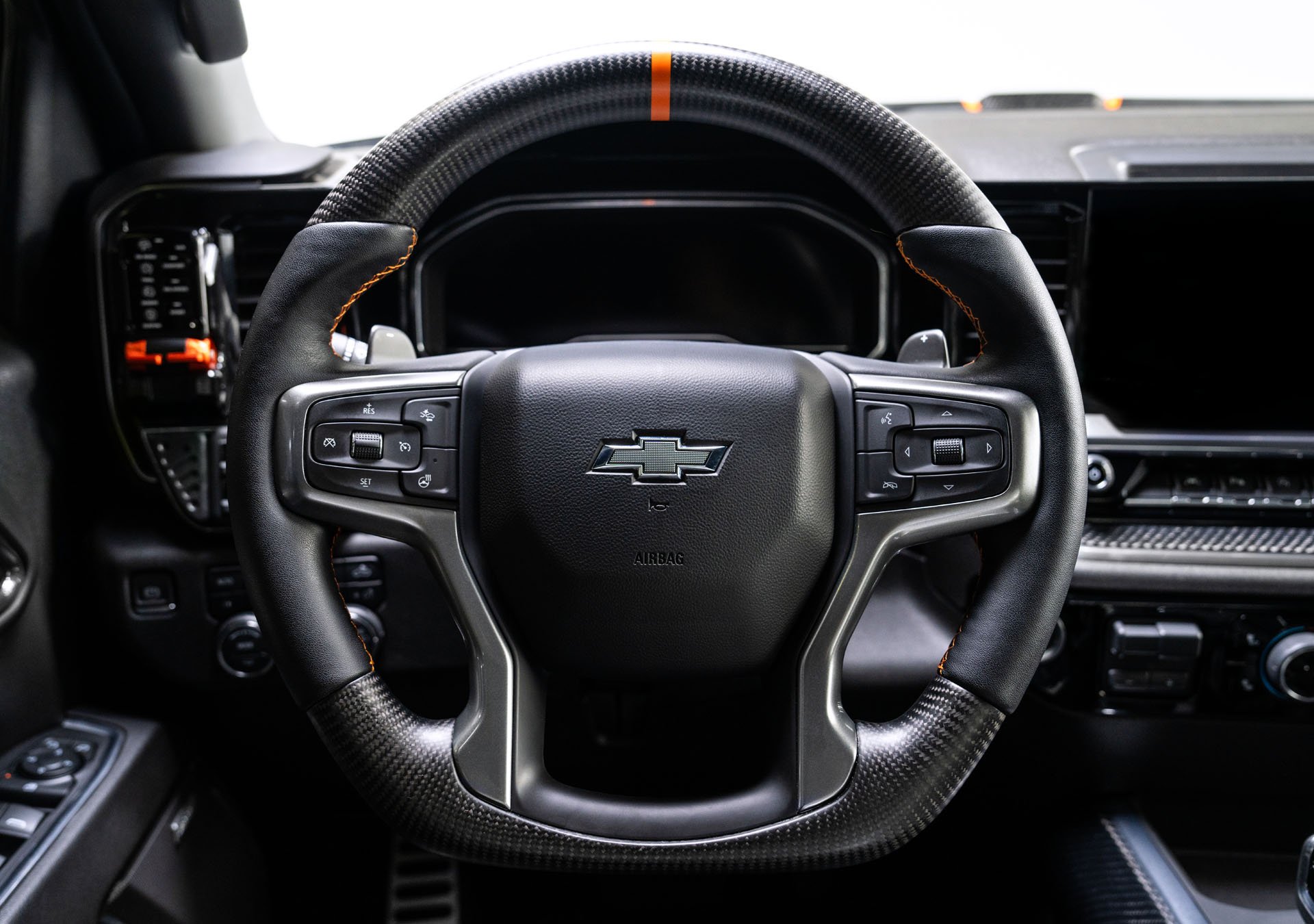 Leather-Wrapped Steering Wheel Accented with an Orange Stitched Center Line