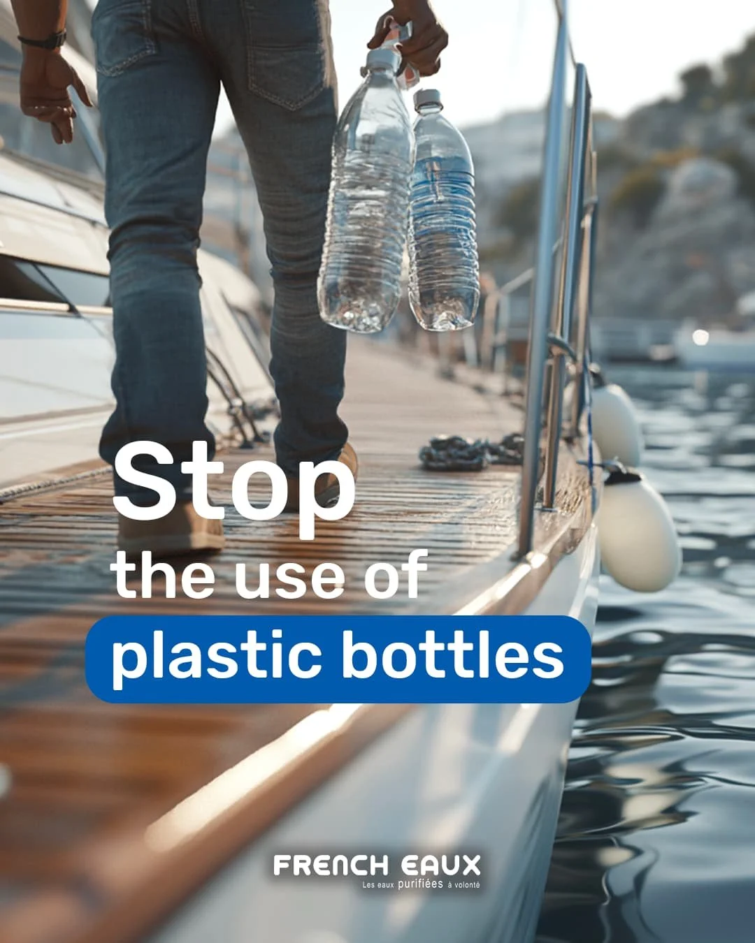 Person holding two plastic water bottles on a boat docked at a marina, with water and other boats in the background.