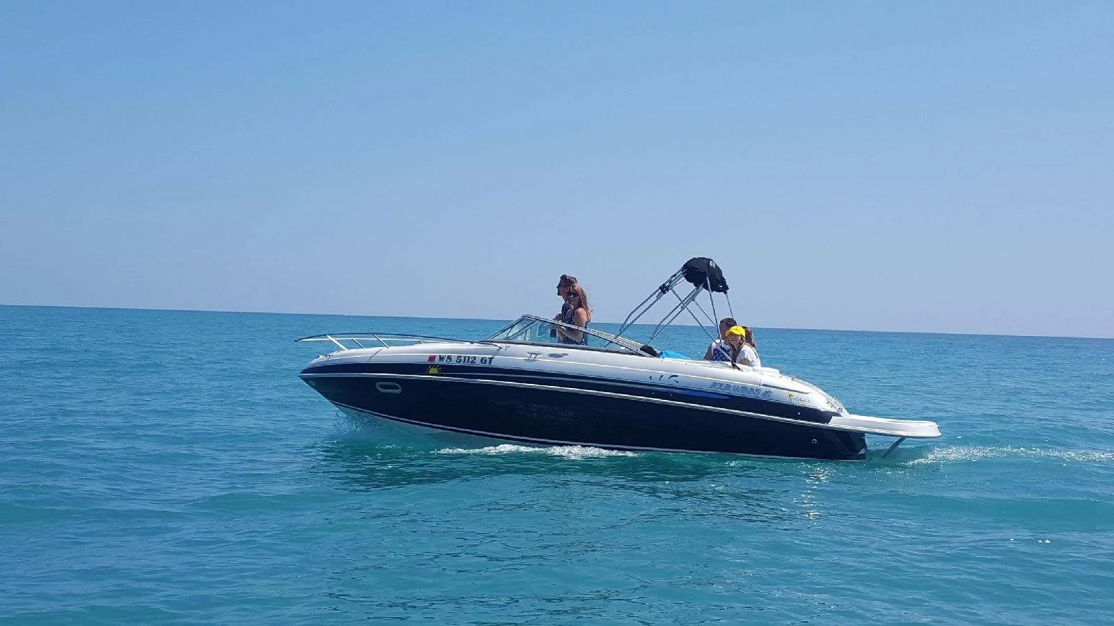 Speedboat on the ocean with people on board