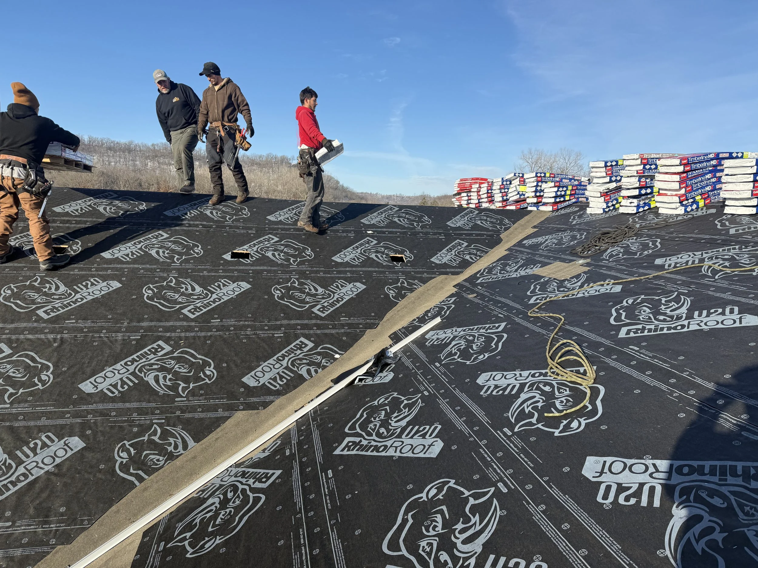A roof replacement in progress in Red Wing, MN. The image shows felt and ice and water shield over top of the sheathing before shingle installaton.