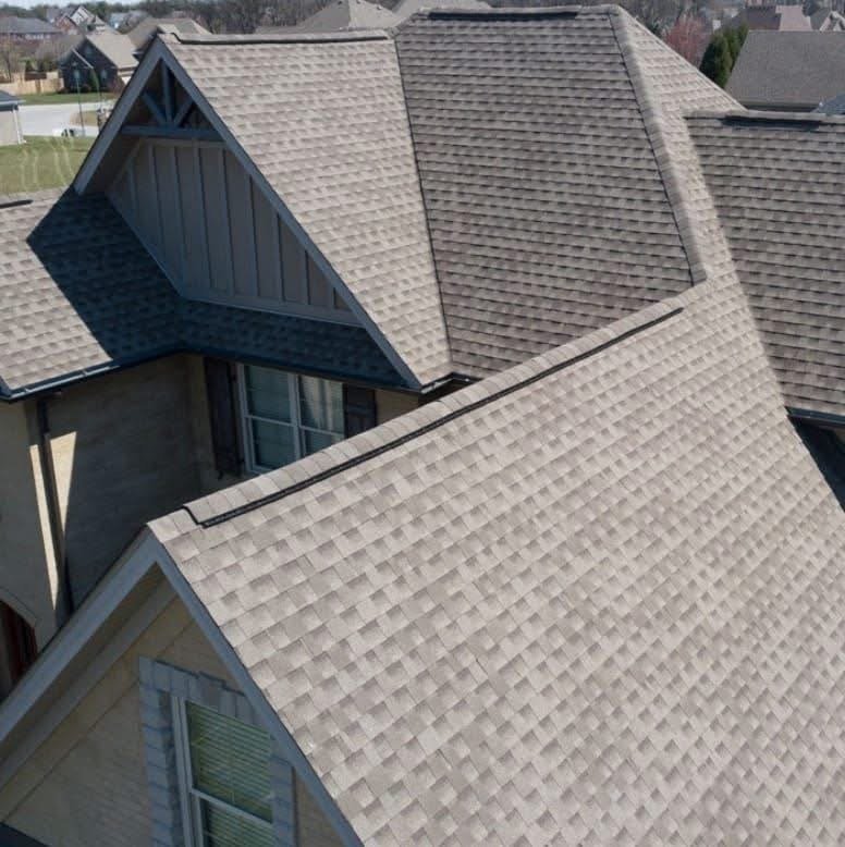 A new roof after install on a multi-story residential home.