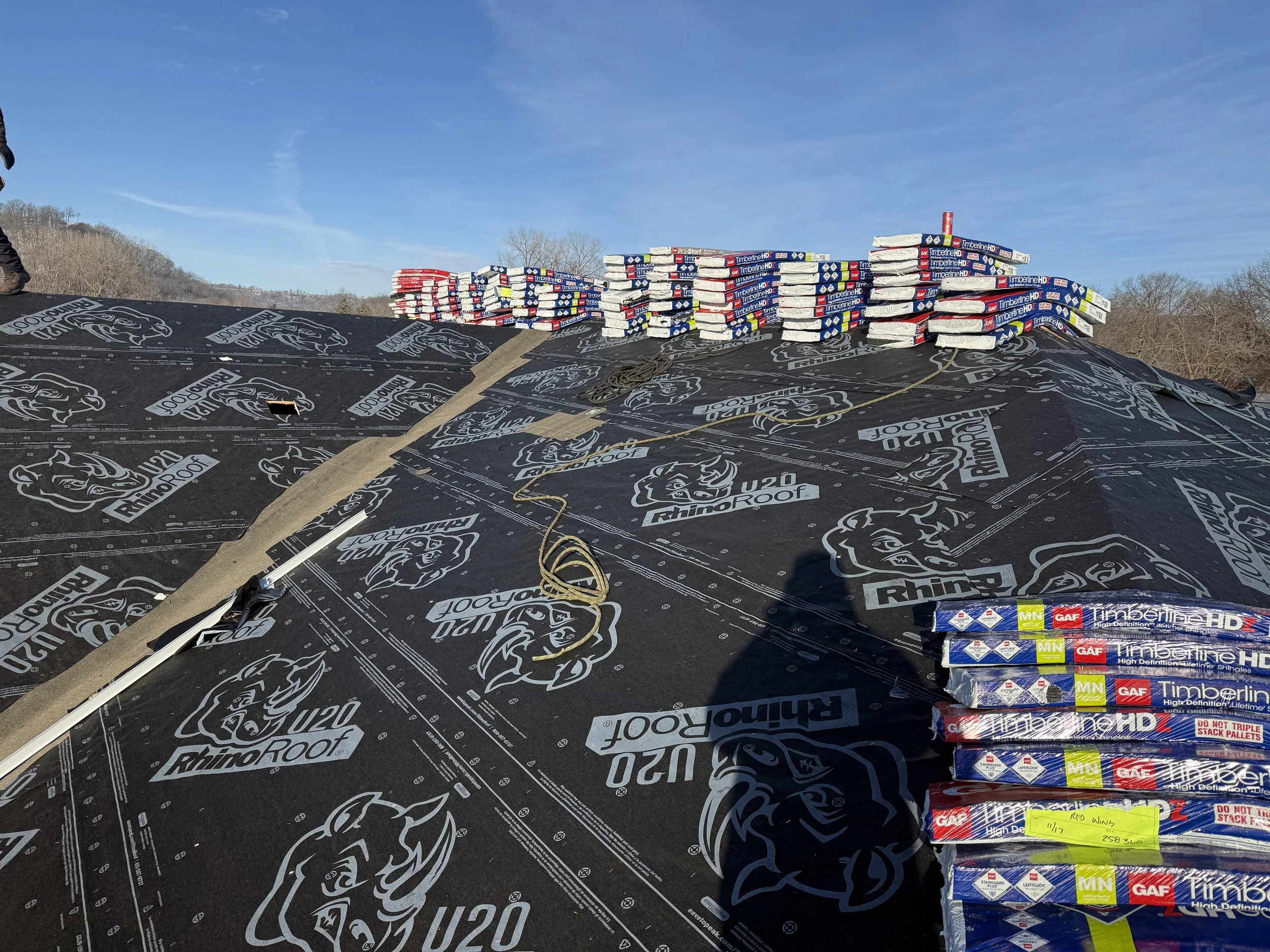 A new construction home in Lake City, MN getting the roof prepped before shingles. The picture shows how the crew laid out felt and Ice and Water shield in preparation for the GAF Timberline Shinges.