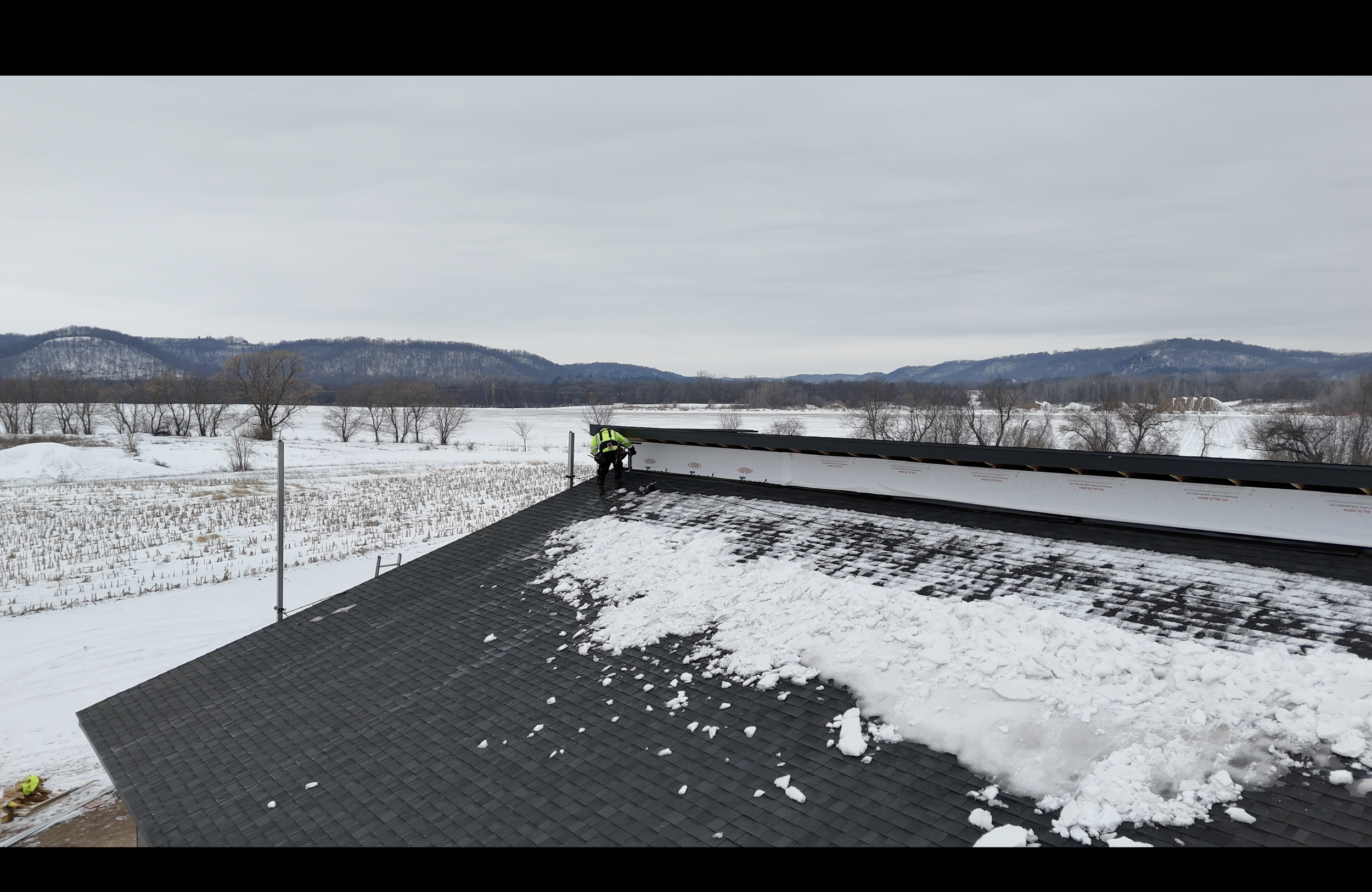 Skyline Roofing Crew installing aluminum soffits on the a new construction home build in Wabasha, MN.
