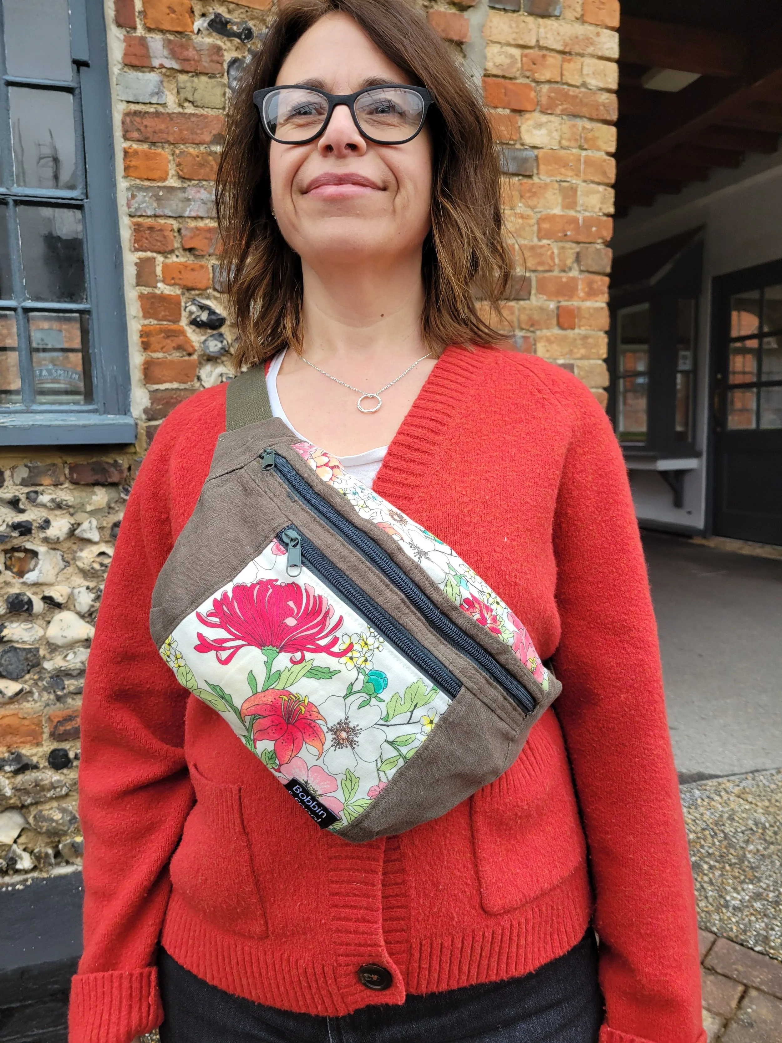 Green linen bum bag worn across chest.jpg