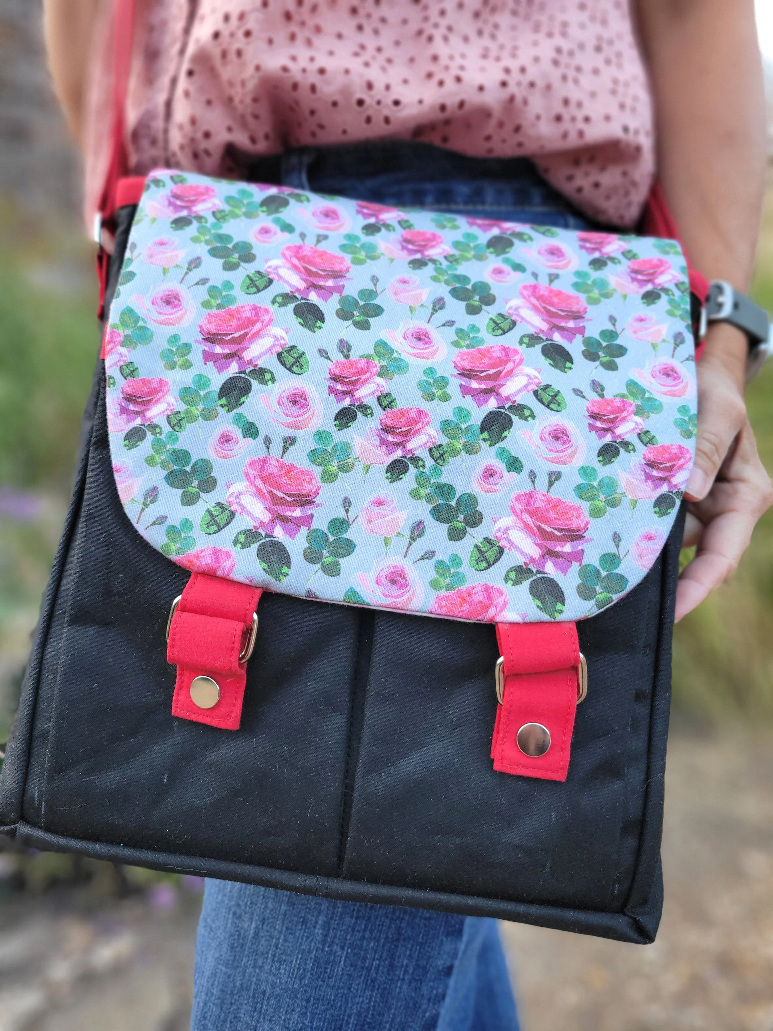 Front view of Botanica rose messenger bag.jpg