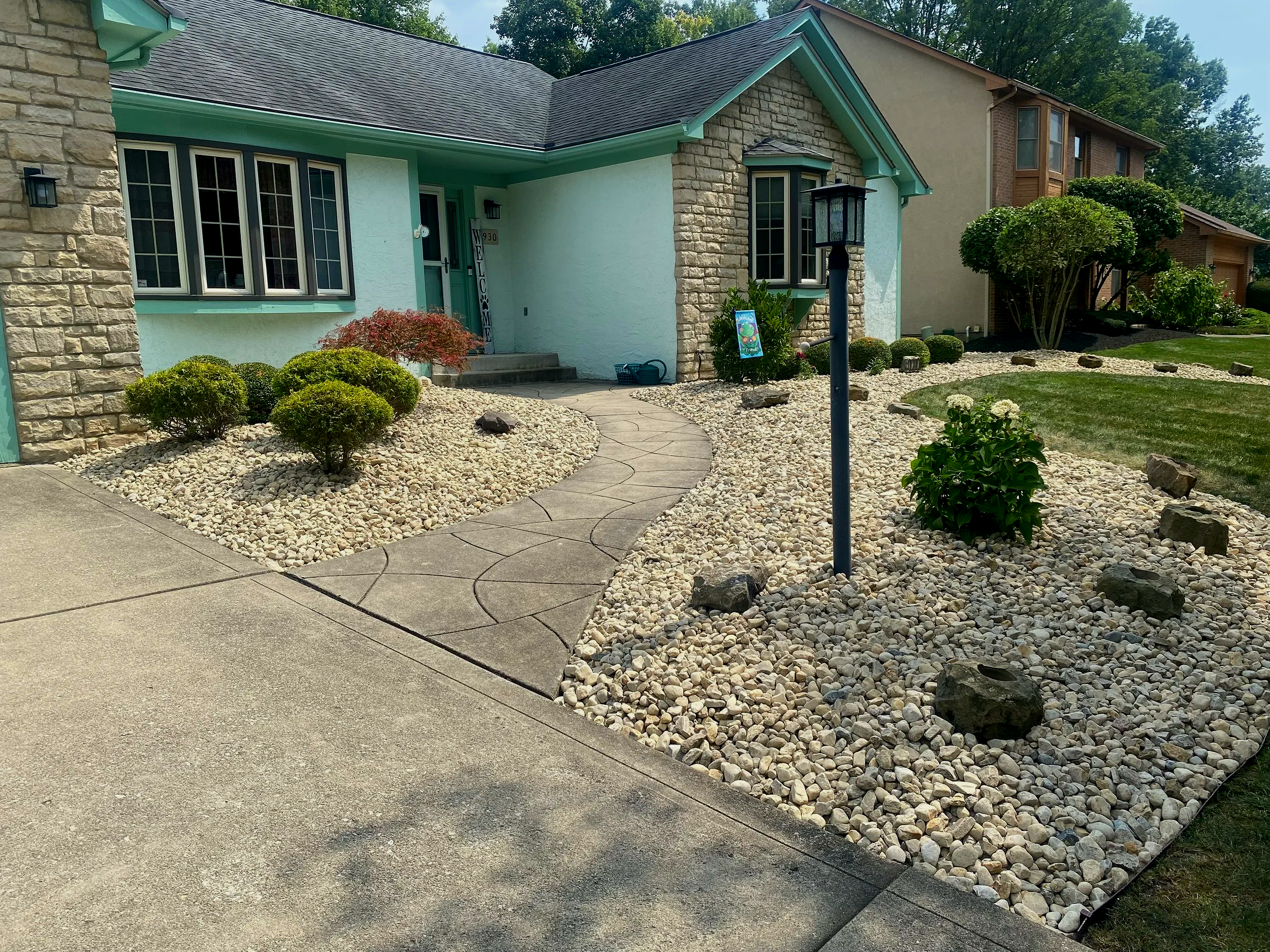 river rock bed installed by landscaping service