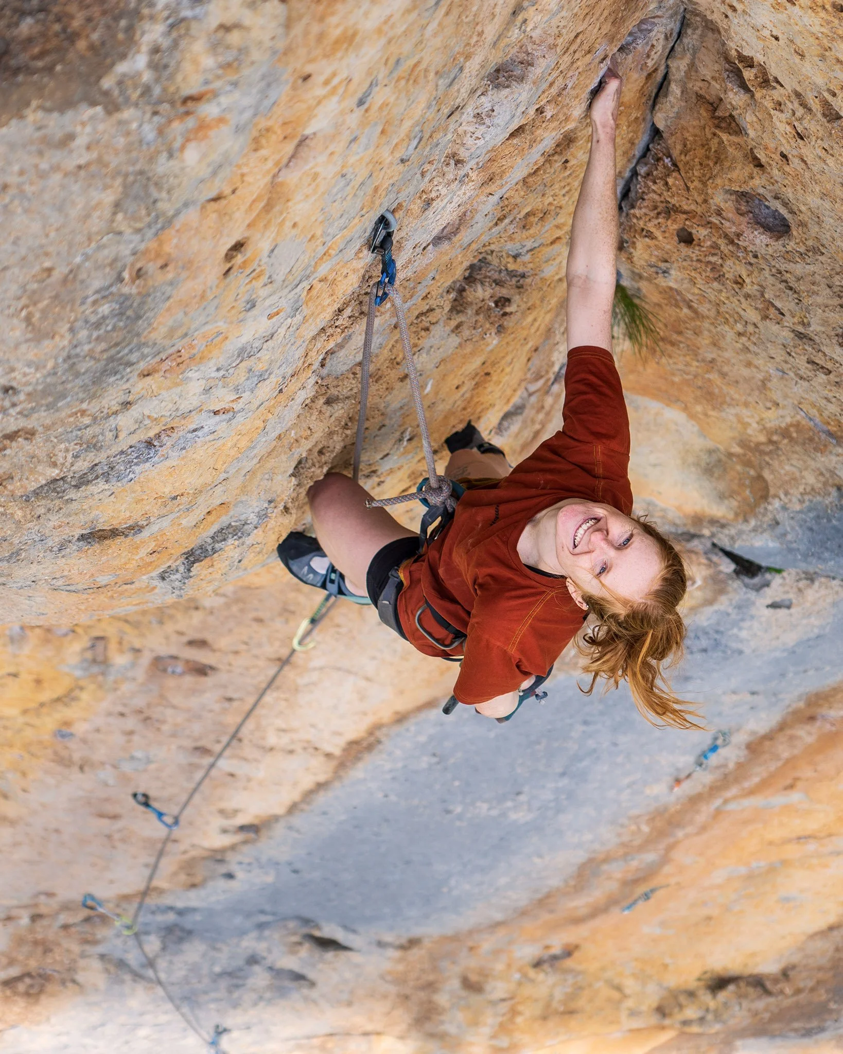 caitlin king - blue mountains based wedding and business photographer, showcasing her adventurous side of life, at a rock climbing place with her camera in hand