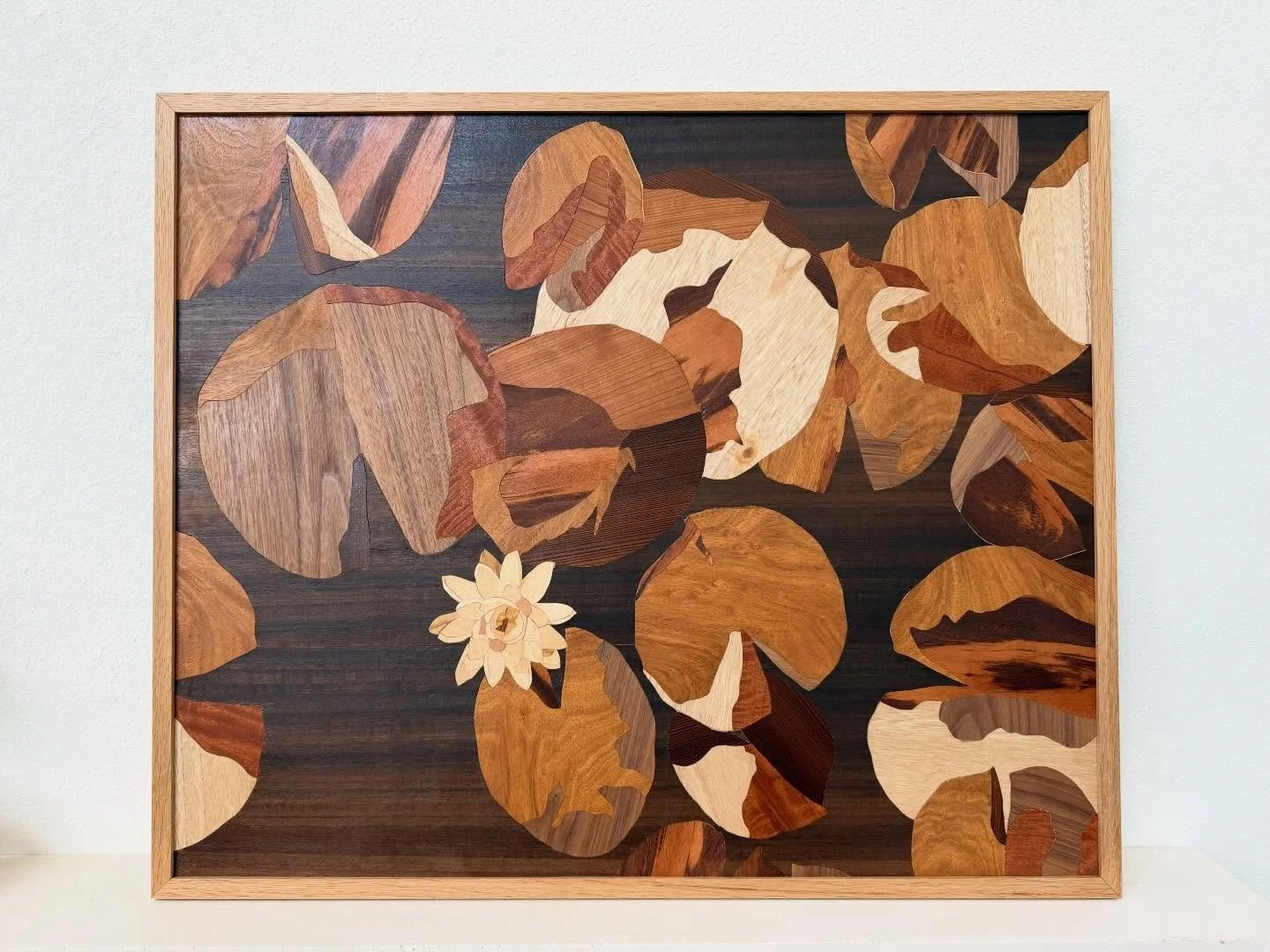 My latest original work exploring the classic beauty of water lilies and lily pads using a variety of wood species. Come stop by my booth this weekend at the @bayoucityartfestival! Hope to see y&rsquo;all there!