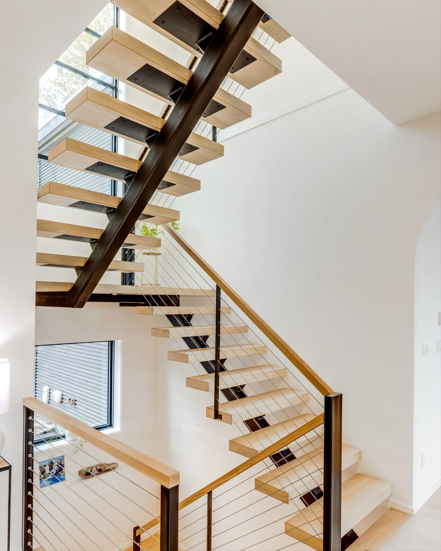 Staircases are a key architectural element - not only for circulation, but for defining spatial flow and hierarchy.
Straight runs create clean, efficient movement through a home, while L-shaped or switchback designs can introduce separation or privac