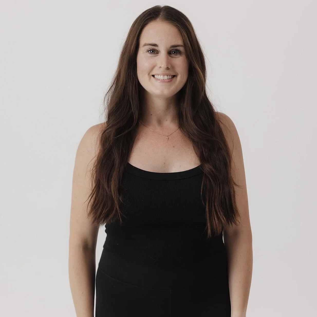 woman smiling with hand on hip