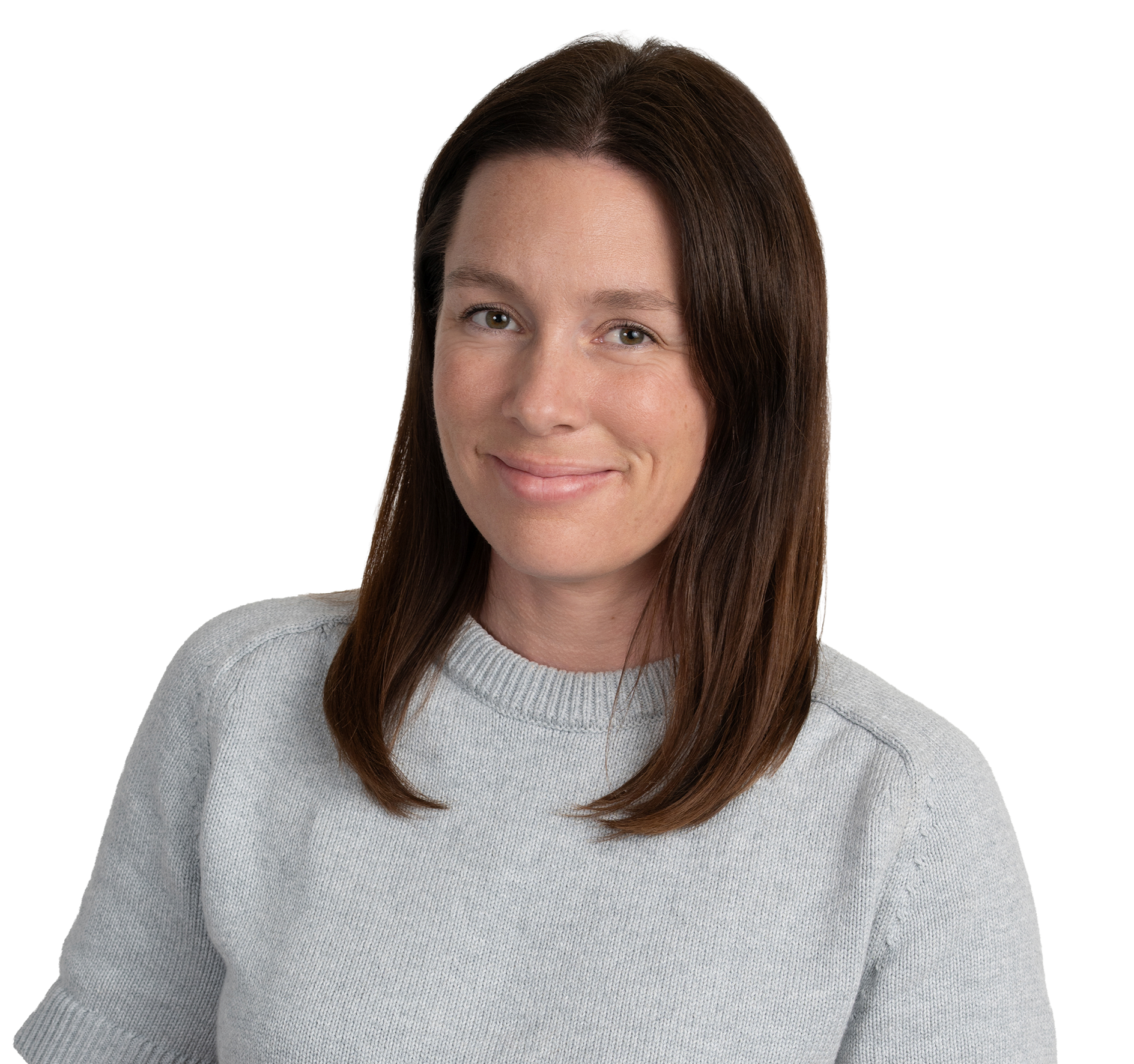 A woman with long brown hair wearing a light gray sweater, smiling.