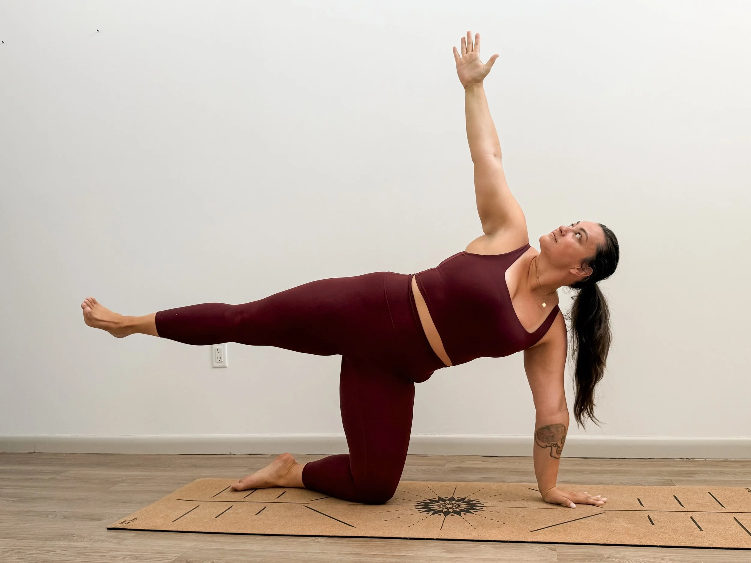 Photo of Katie Mackey, Founder of the Marra Method in a balance pose