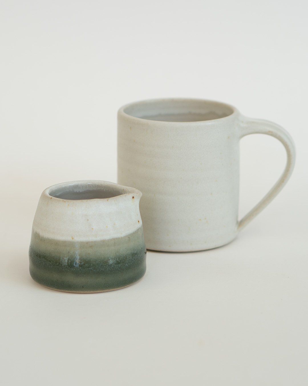 Small white and green jug