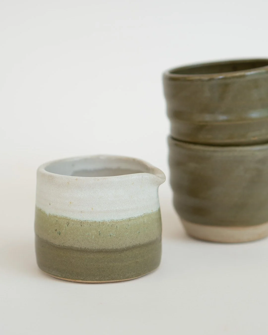 Small white and green jug