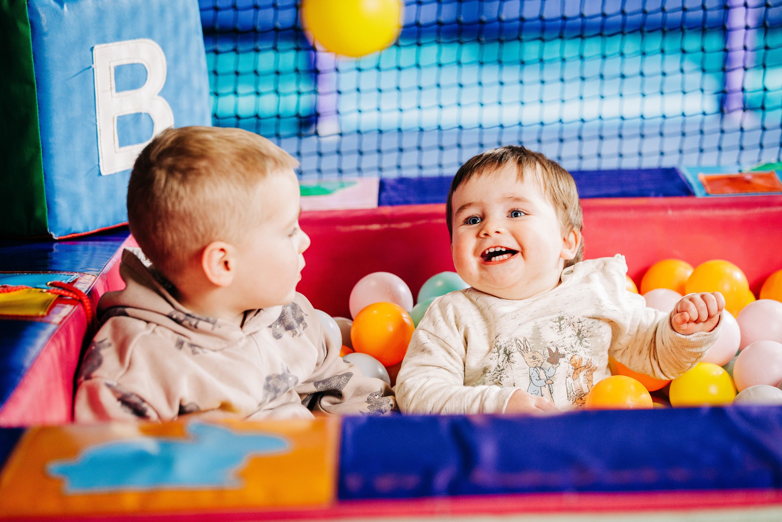 Two children in a ballpit at The Play Cove.