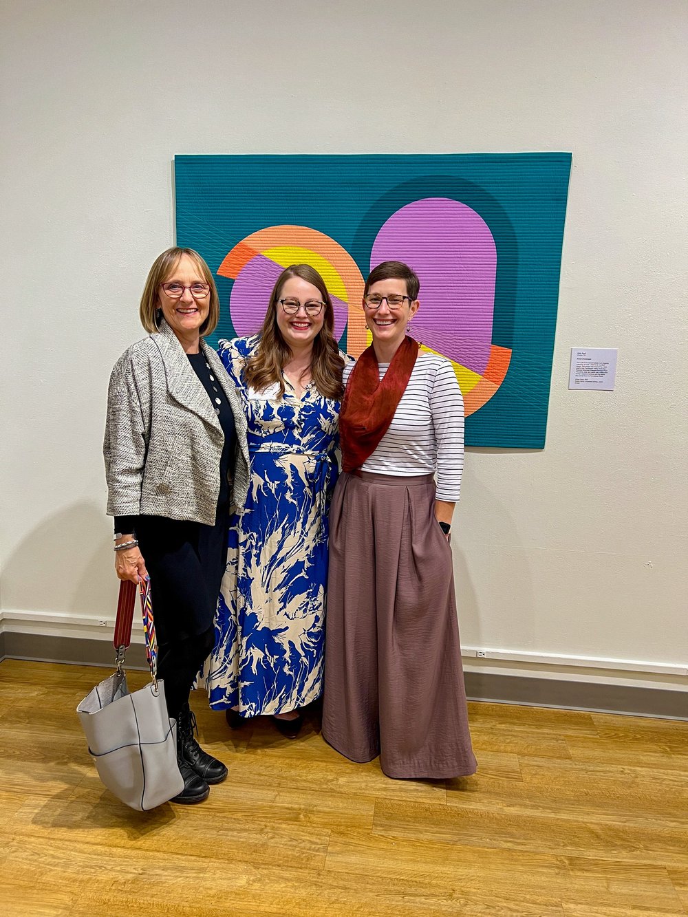 Lenny van Eijk, Audrey Esarey, and me with Citron Swirl at Quilts=Art=Quilts 2022