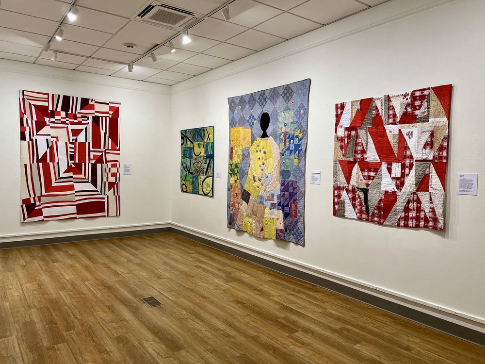 Quilts by Barbara Danzi, Jette Clover, Imani Russell, and Chandra Wu.