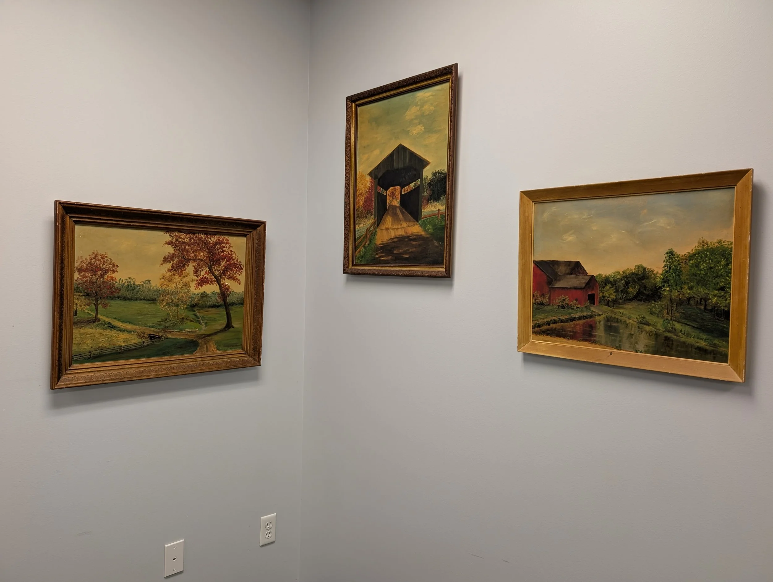 3 wall paintings that were painted by Laura's great grandmother