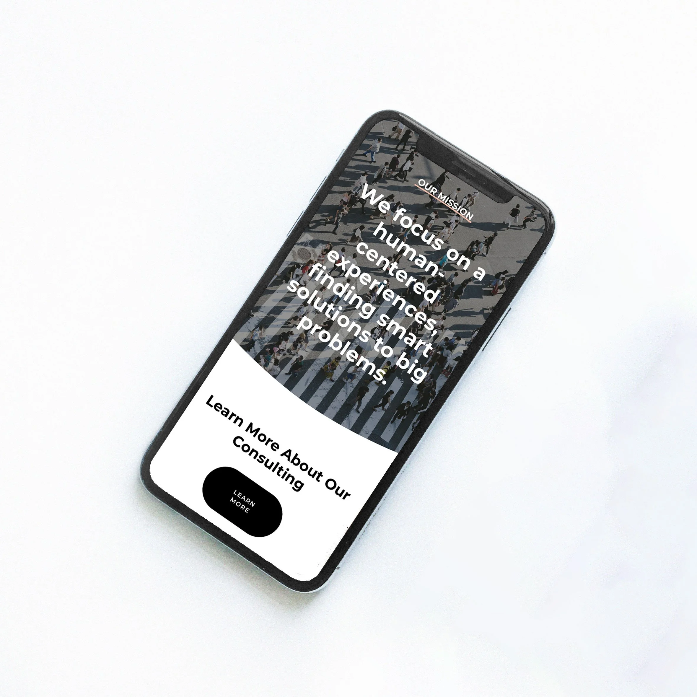 Smartphone displaying a Fem Finance's webpage with text about human-centered experiences and solutions to problems, along with a "Learn More" button.