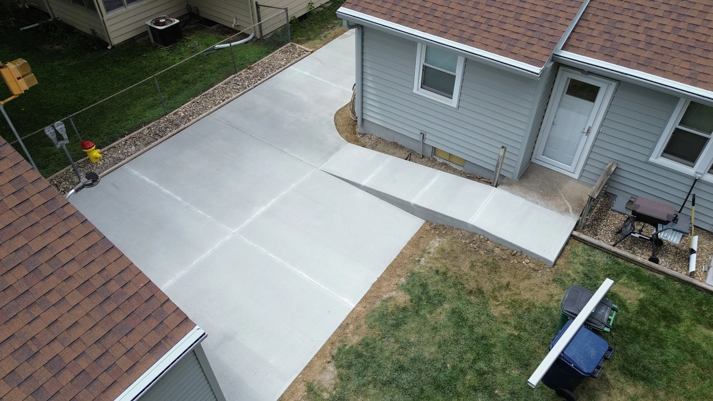 backyard handicap accessible concrete ramp and driveway pad