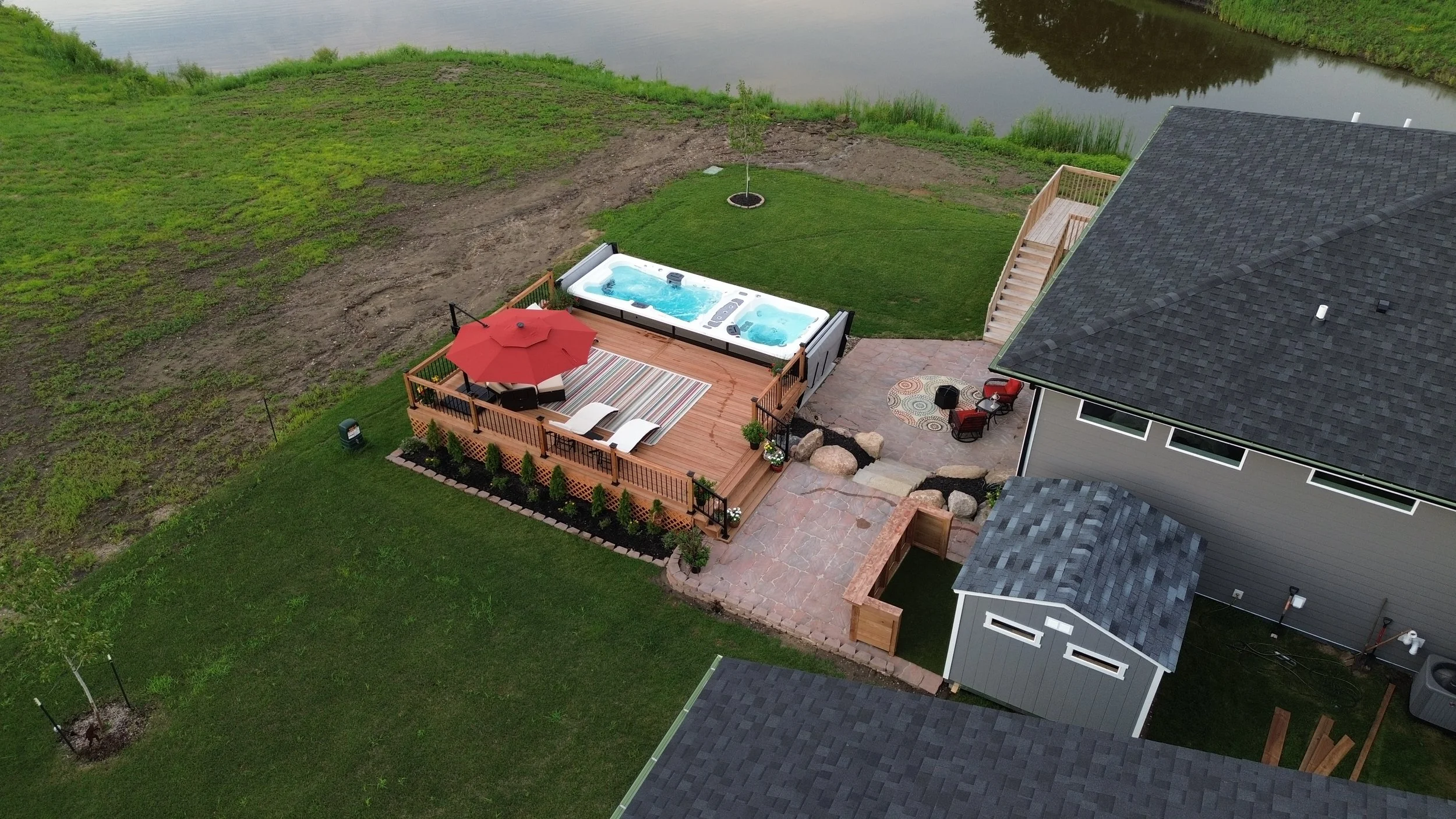 Aerial view of a backyard deck and swim spa project