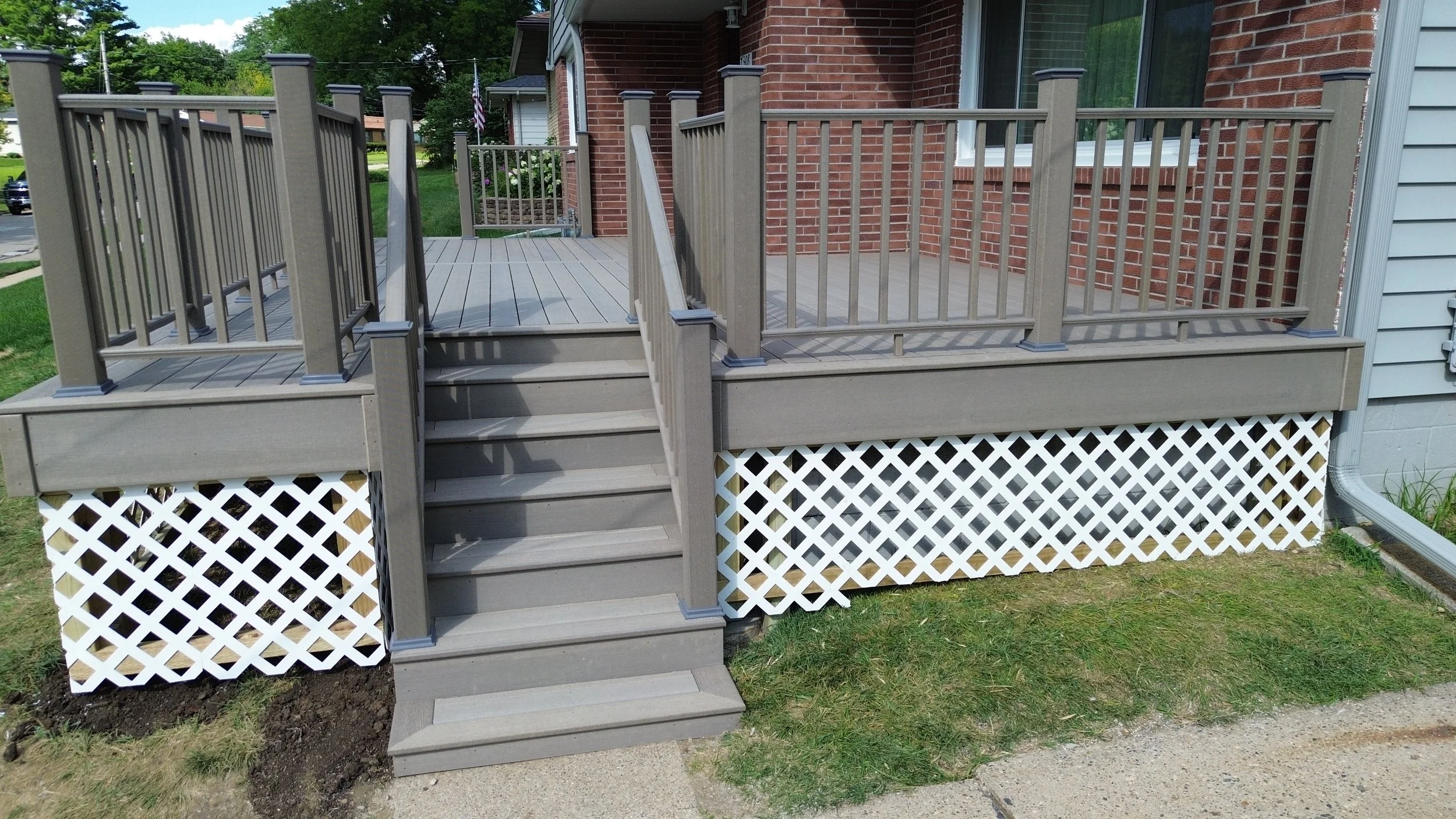 custom deck build with steps and railing