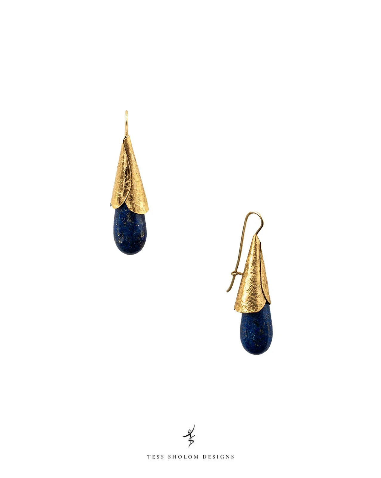 Gold and blue teardrop-shaped earrings with textured gold leaves on a white background, Tess Sholom Designs logo at the bottom.