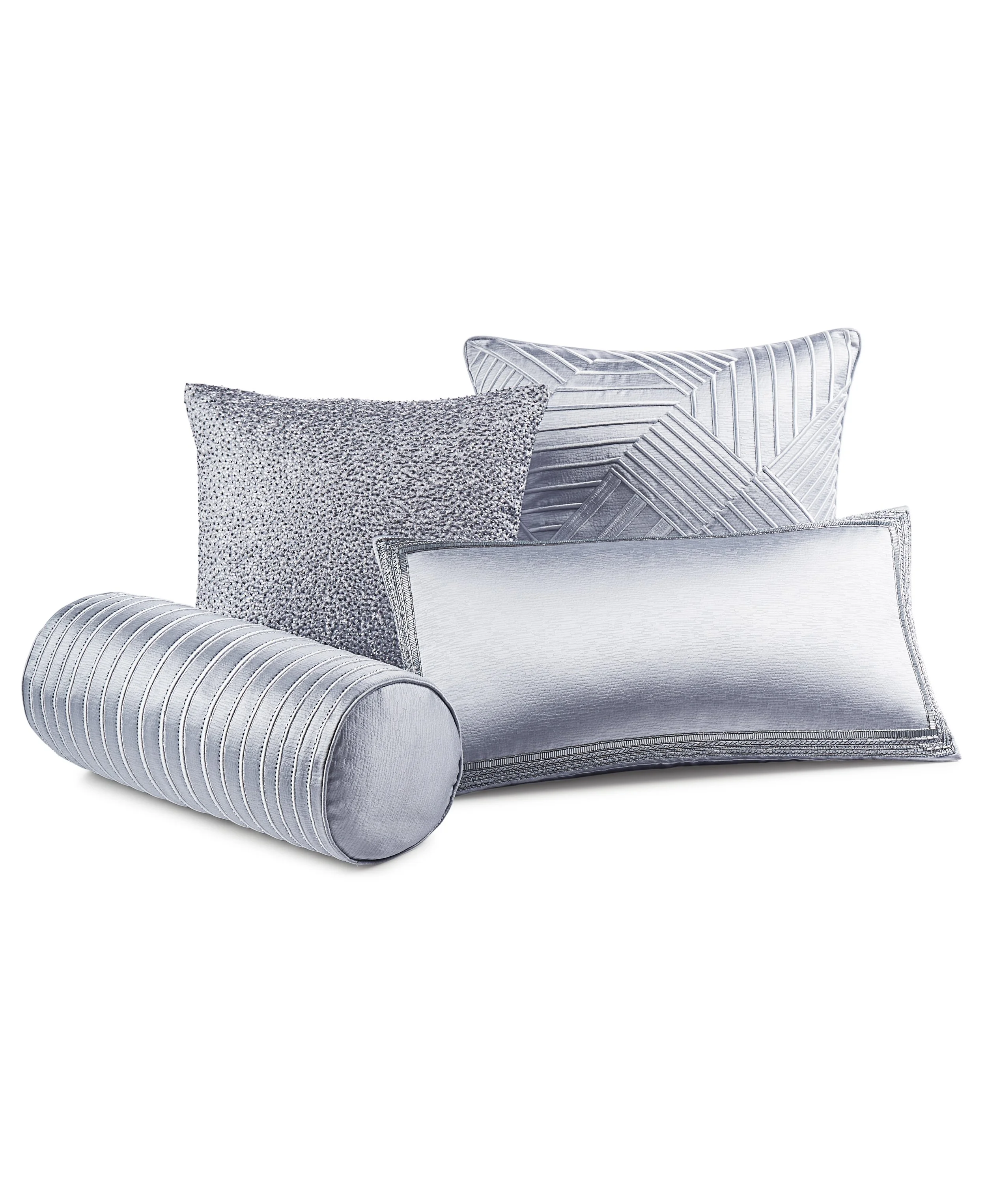 Set of decorative pillows in silver and gray tones with different patterns, including striped, textured, and geometric designs.