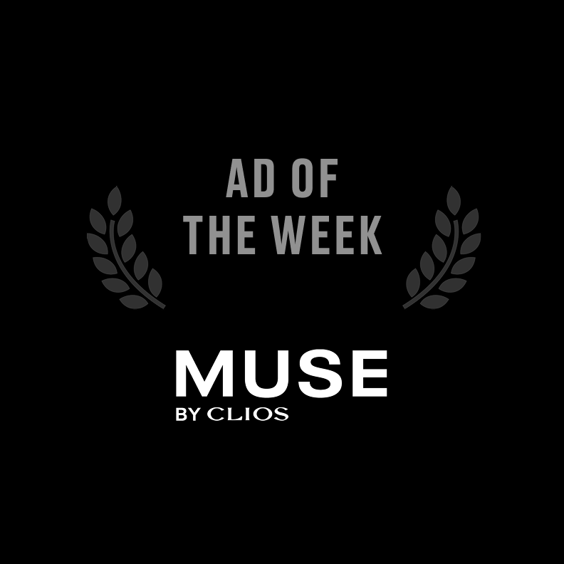 Black background with gray laurel branches, text reading "Ad of the Week" in gray and "Muse by Clio" in white.