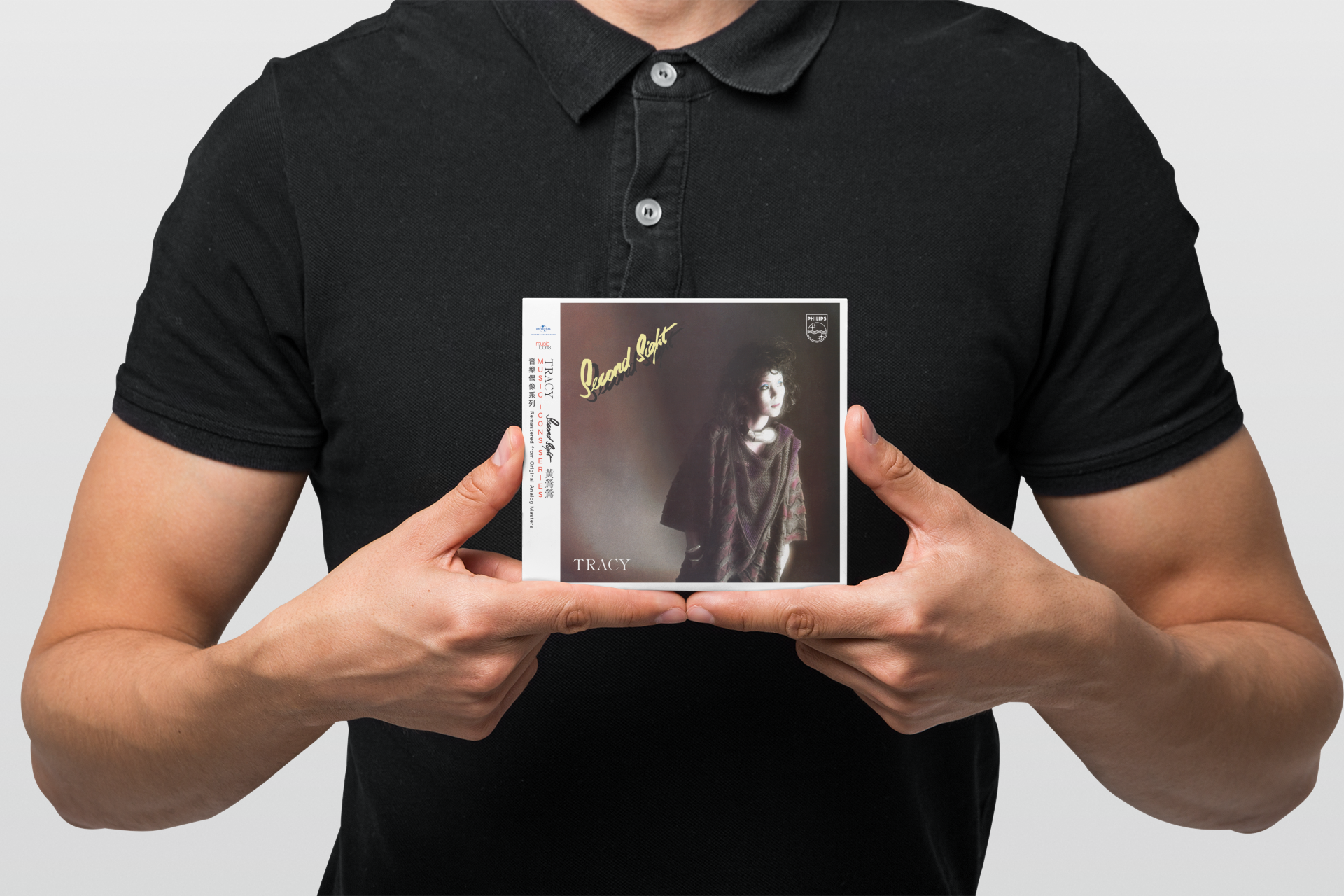 mockup-of-a-man-holding-a-digipak-with-both-hands-28334.png
