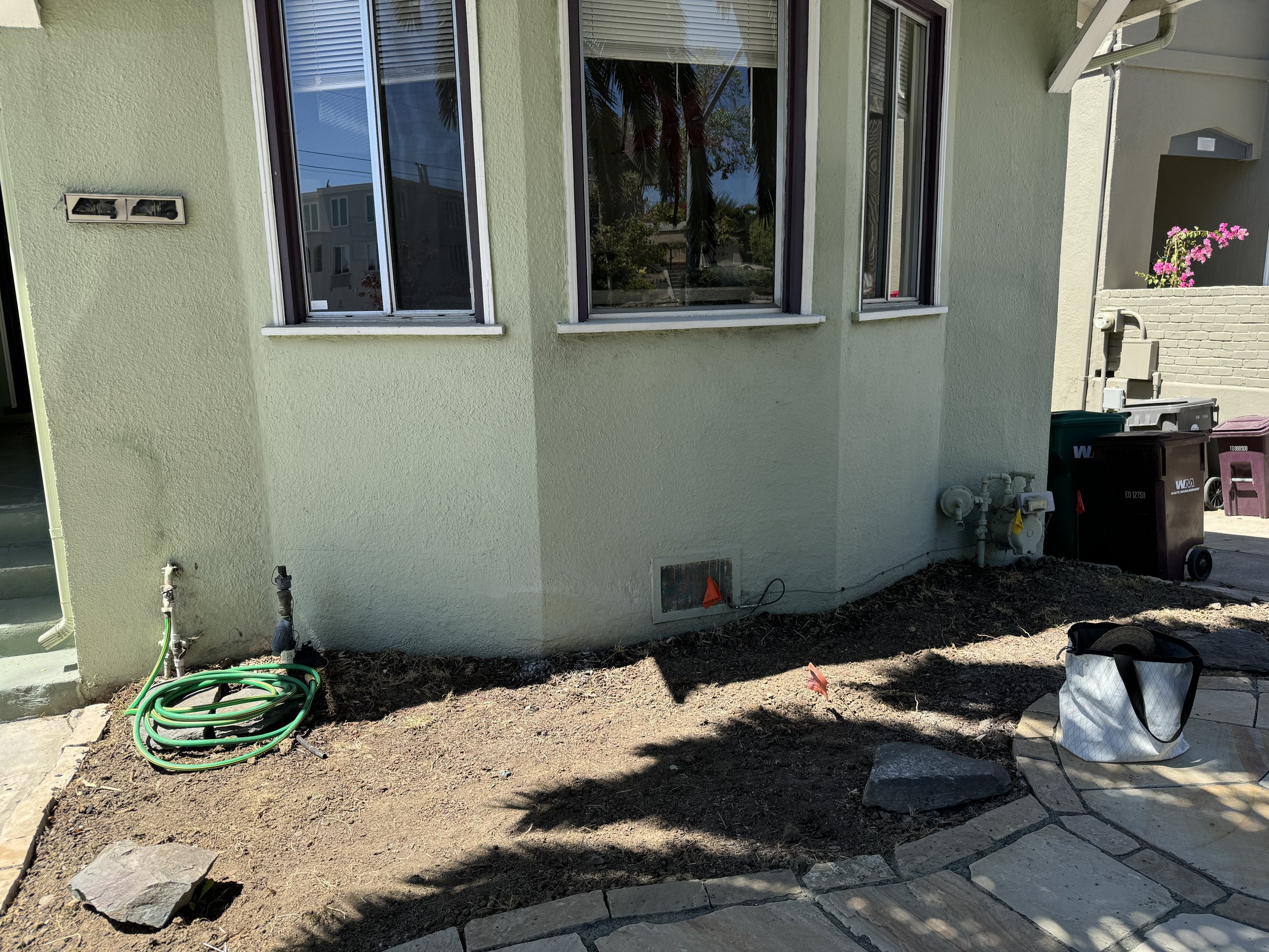 Next to house after clearing