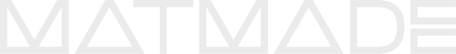 Close-up of a black and white text sign with the words "Made in" in stylized font.
