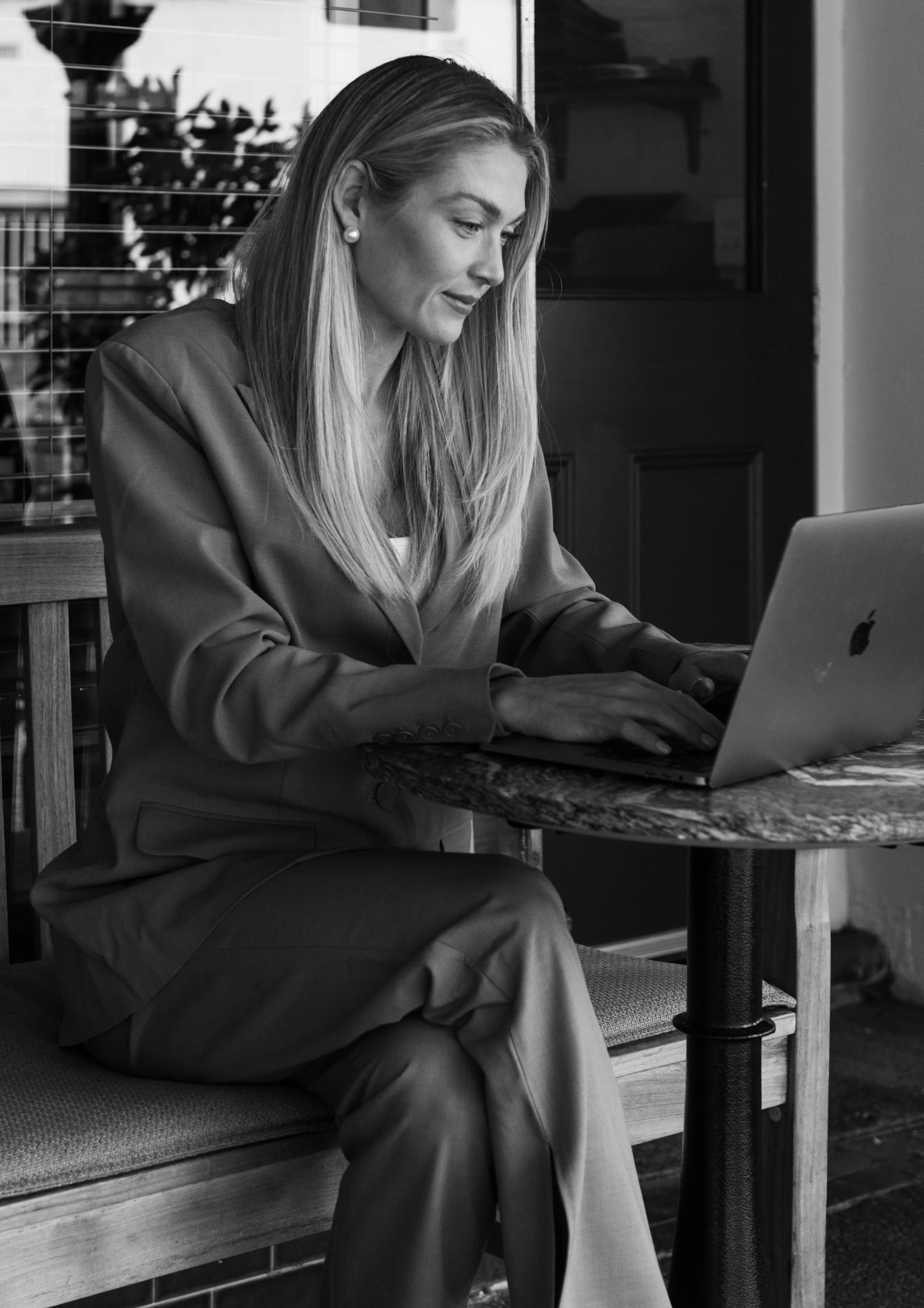 Lauren Murphy, talent manager, working at her laptop