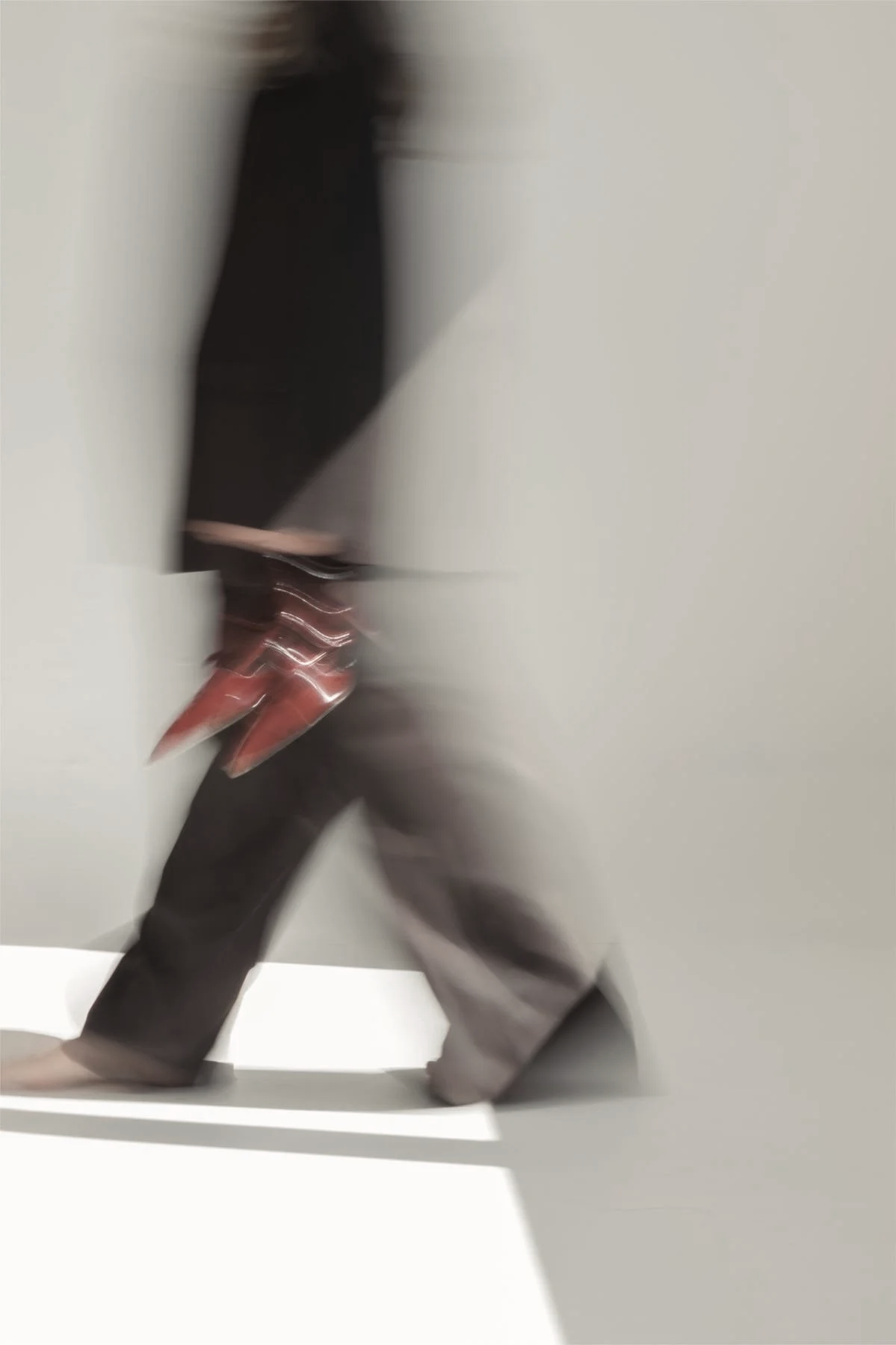 Motion-blurred image of a woman walking