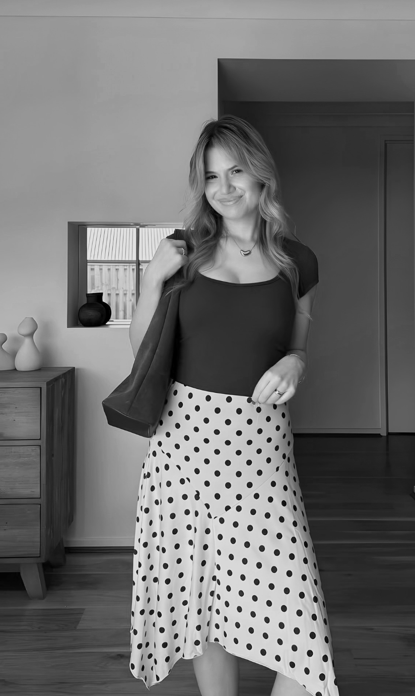 Content creator styled in a polka dot skirt