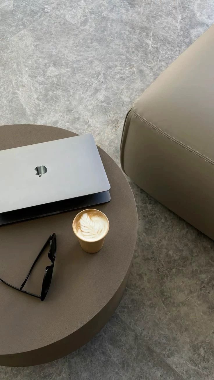 Laptop and coffee on a table
