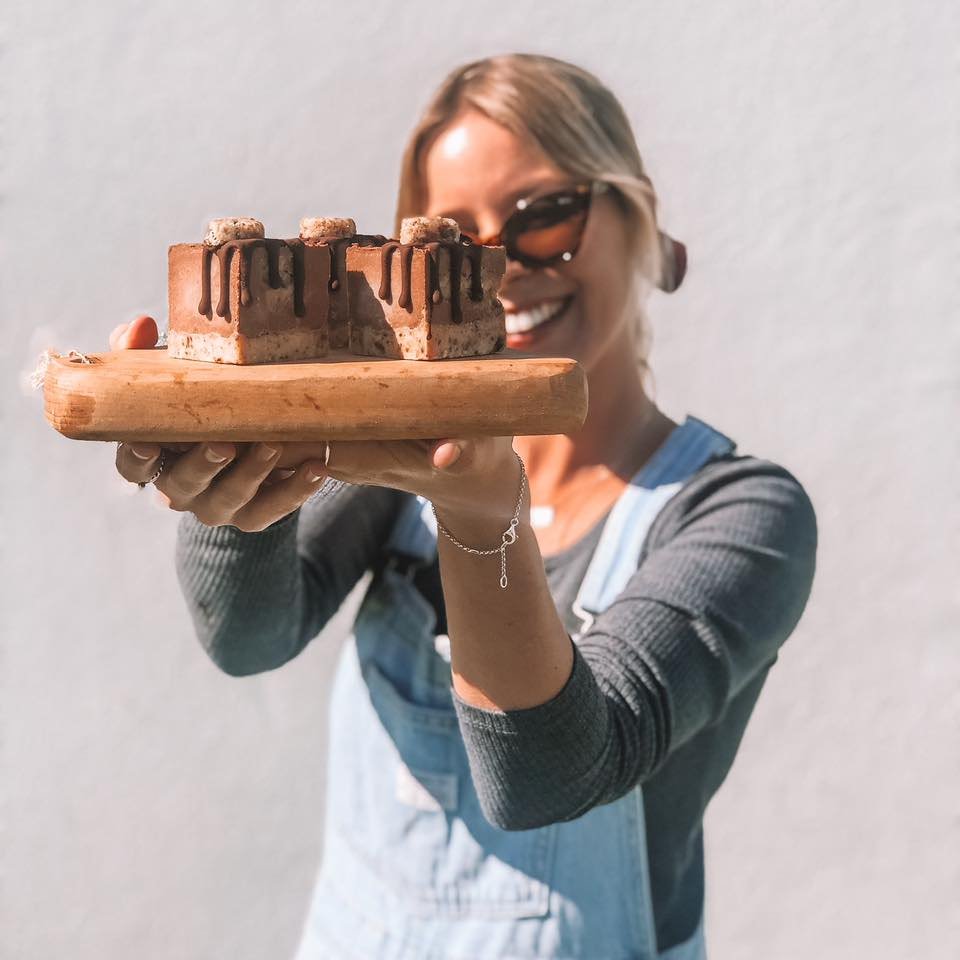 Bec holding a wooden serving board