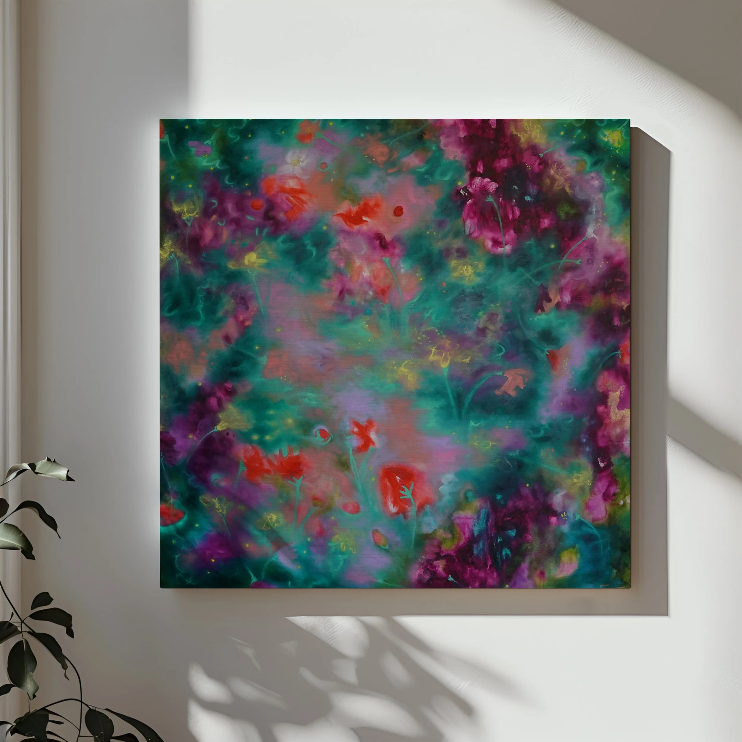 Abstract colorful painting of melting florals with greens, purples, pinks, and reds hanging on white wall.