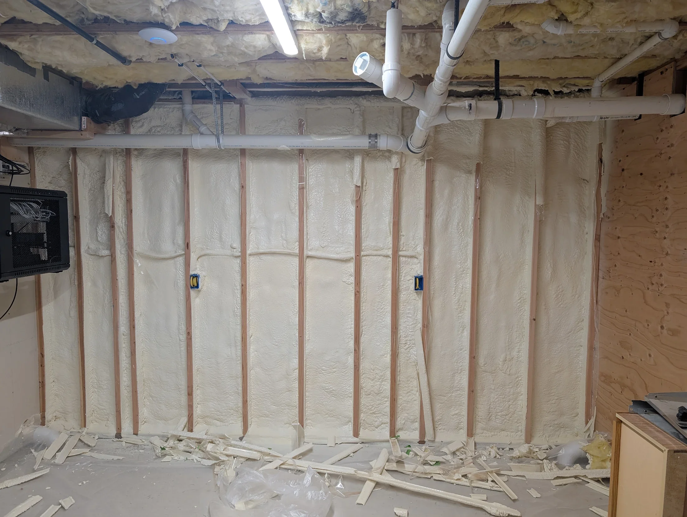 BASE CAMP SPRAY FOAM INSULATION IN BASEMENT WALLS