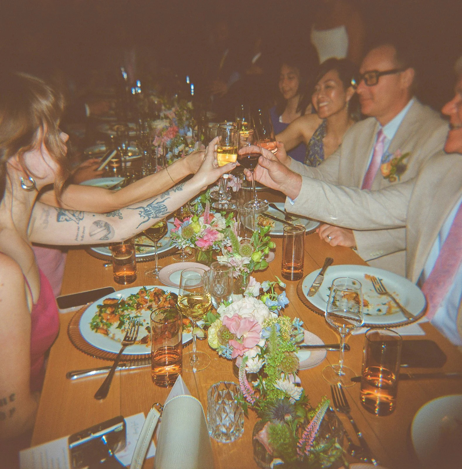 Guests clinking drinks at a unique wedding venue