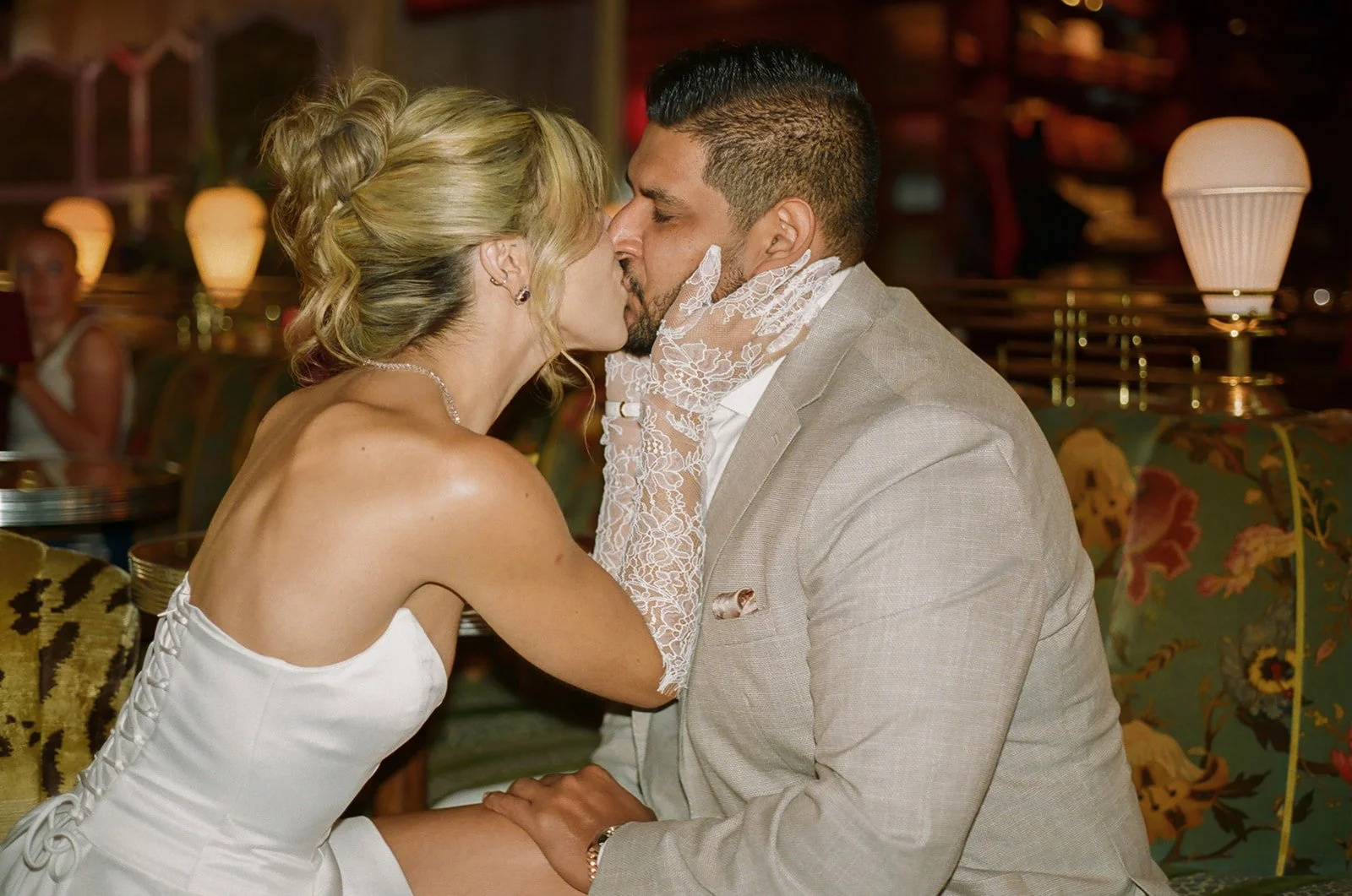 A couple kissing during engagement photos at Lafayette Hotel