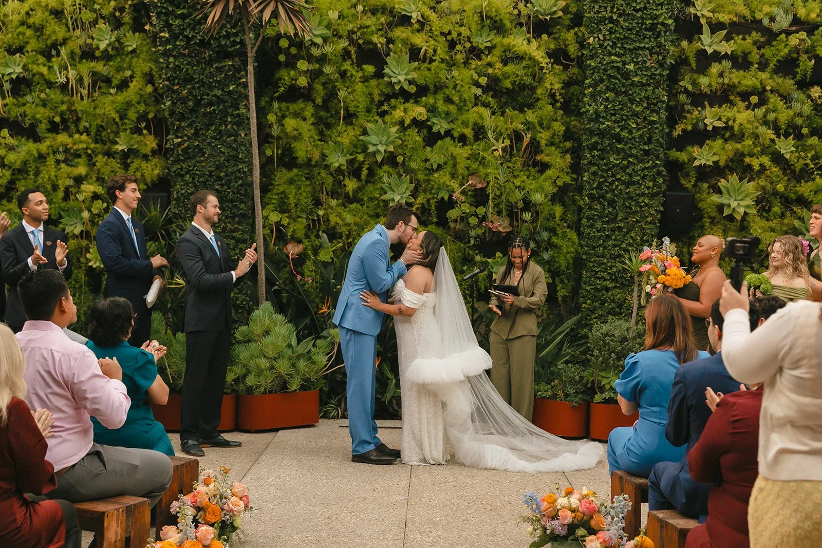 A bride and groom's first kiss at SmogShoppe