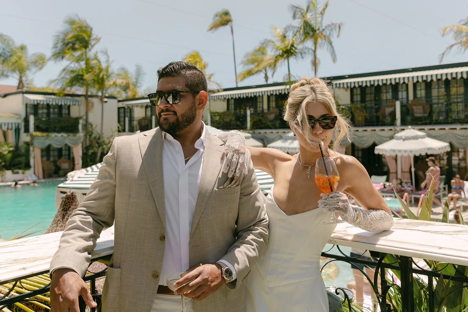 A couple by the pool at the Lafayette Hotel