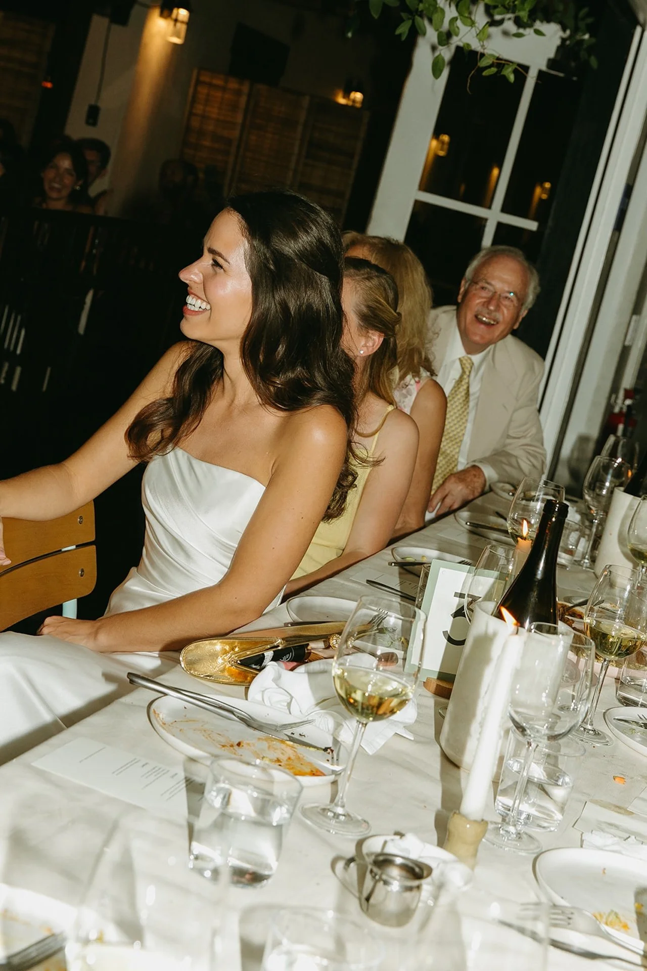The bride laughing at her groom as her gives a speed at their San Juan Capistrano Wedding venue