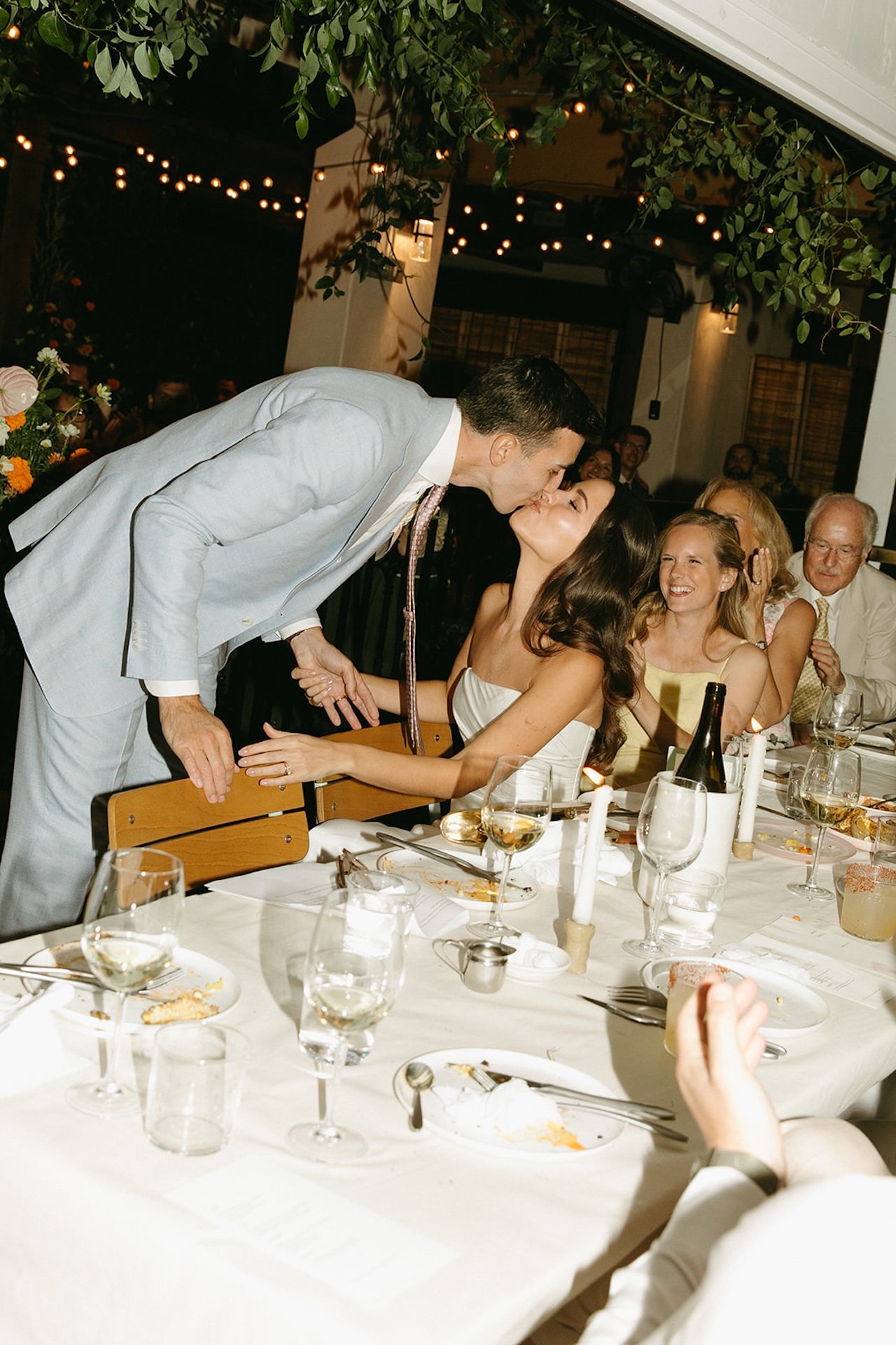 The groom giving his bride a kiss after his speech at their San Juan Capistrano Wedding venue