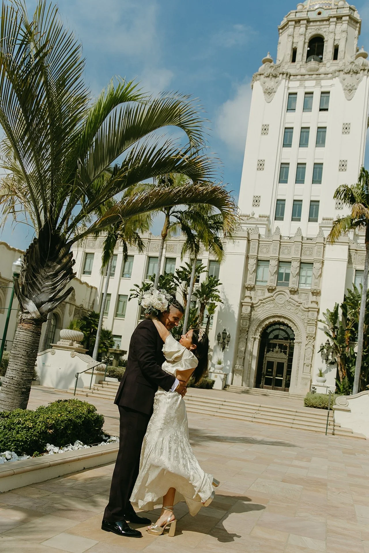 Bride and groom outside of the Beverly Hills Courthouse before their ceremony.