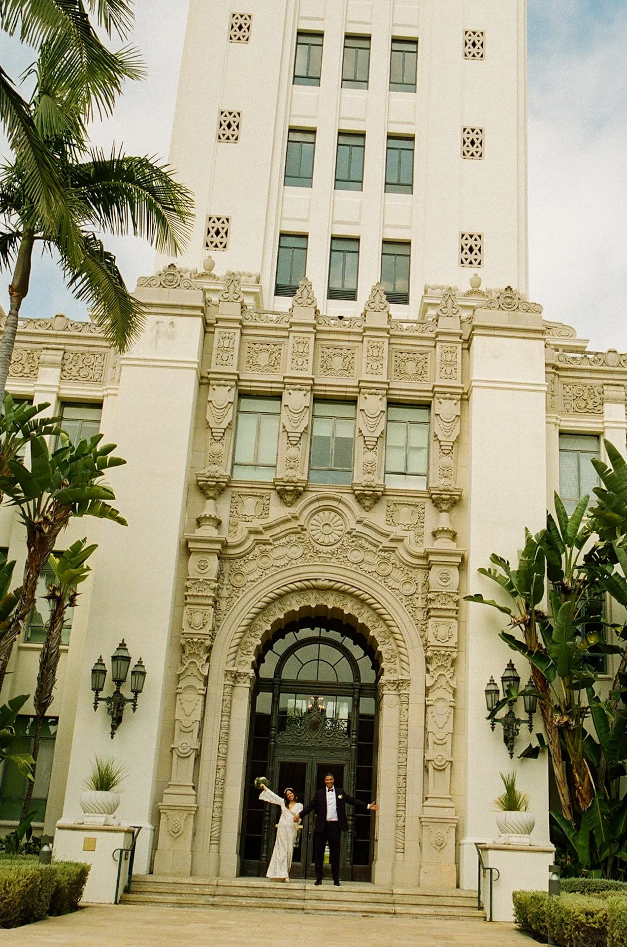 Couple walking into Beverly Hills Courthouse for their elopement