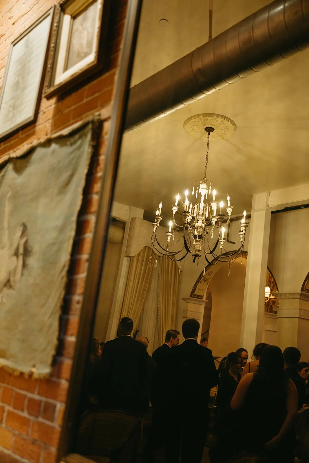 A detail photo at a DTLA wedding venue of a chandelier hanging in the entry way.